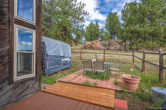 wooden deck featuring a patio area