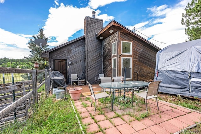 back of property with a patio area