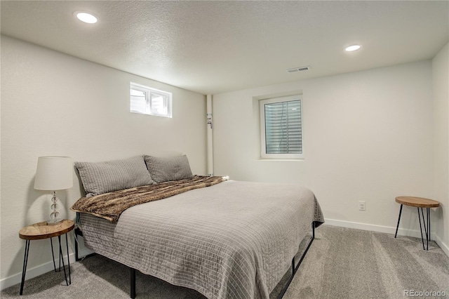 bedroom featuring baseboards, visible vents, carpet flooring, and recessed lighting