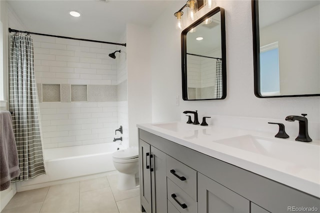 full bath with shower / tub combo, a sink, toilet, and tile patterned floors