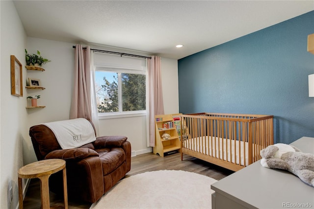 bedroom with light wood-type flooring and recessed lighting