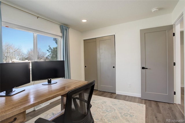 office with baseboards, wood finished floors, and recessed lighting