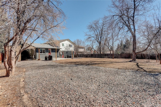 exterior space with brick siding and fence