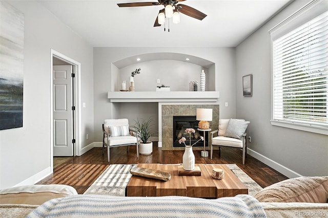 6039 Quay Ct, Arvada, CO 80003 - living room featuring a ceiling fan, a tile fireplace, and wood finished floors