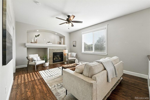 6039 Quay Ct, Arvada, CO 80003 - living room featuring a tiled fireplace, wood finished floors, and a ceiling fan