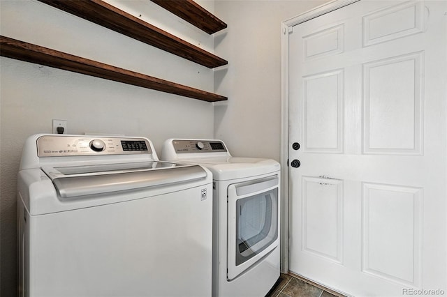 6039 Quay Ct, Arvada, CO 80003 - laundry area featuring washer and dryer and dark tile patterned flooring