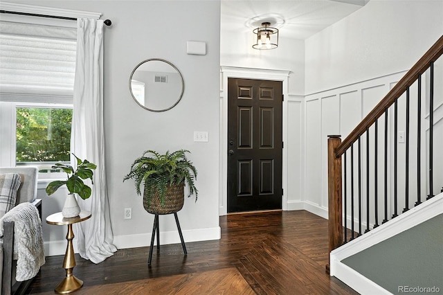6039 Quay Ct, Arvada, CO 80003 - foyer featuring stairway, wood finished floors, and a decorative wall