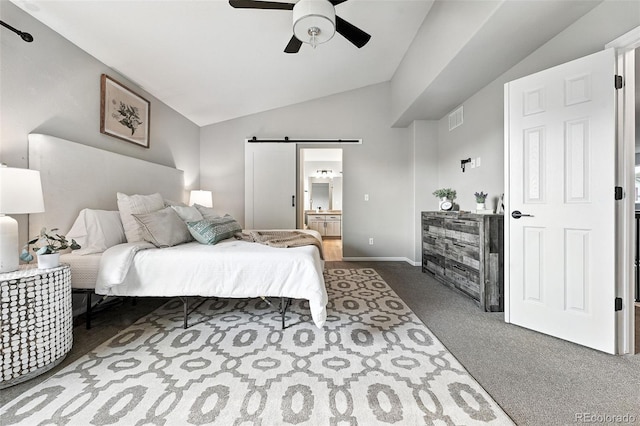 6039 Quay Ct, Arvada, CO 80003 - carpeted bedroom with a barn door, vaulted ceiling, ensuite bathroom, and ceiling fan