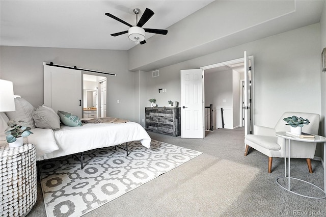 6039 Quay Ct, Arvada, CO 80003 - carpeted bedroom with lofted ceiling, ensuite bathroom, a barn door, and ceiling fan