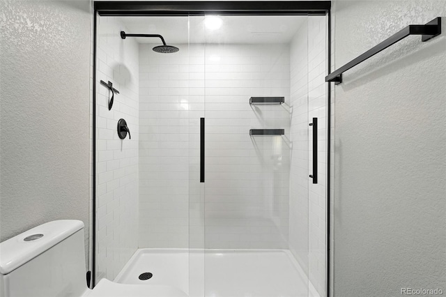 6039 Quay Ct, Arvada, CO 80003 - bathroom with a textured wall and a stall shower