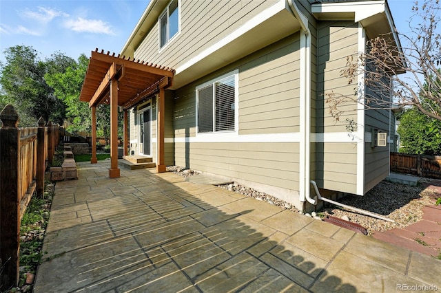 6039 Quay Ct, Arvada, CO 80003 - view of side of home featuring a patio area, a fenced backyard, and entry steps