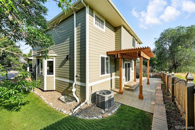 6039 Quay Ct, Arvada, CO 80003 - back of house with a pergola, a patio area, and a fenced backyard