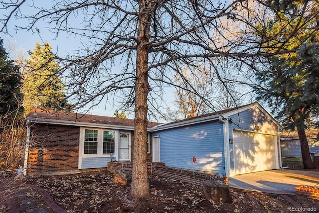 ranch-style house featuring a garage