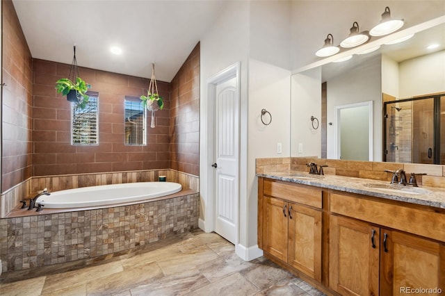 12441 Woodruff Dr, Colorado Springs, CO 80921 - full bath featuring a garden tub, double vanity, and a shower stall