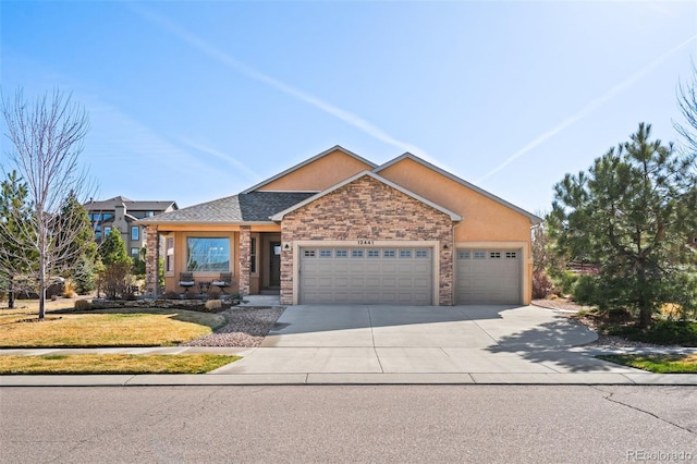12441 Woodruff Dr, Colorado Springs, CO 80921 - view of front of house featuring an attached garage, concrete driveway, and a front yard