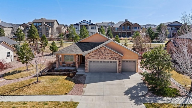 12441 Woodruff Dr, Colorado Springs, CO 80921 - ranch-style house featuring a residential view, concrete driveway, and an attached garage