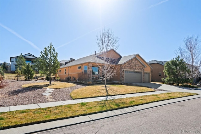 12441 Woodruff Dr, Colorado Springs, CO 80921 - view of front of property with an attached garage and driveway