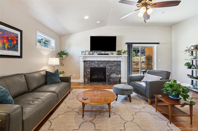 12441 Woodruff Dr, Colorado Springs, CO 80921 - living area with vaulted ceiling, ceiling fan, wood finished floors, a fireplace, and recessed lighting