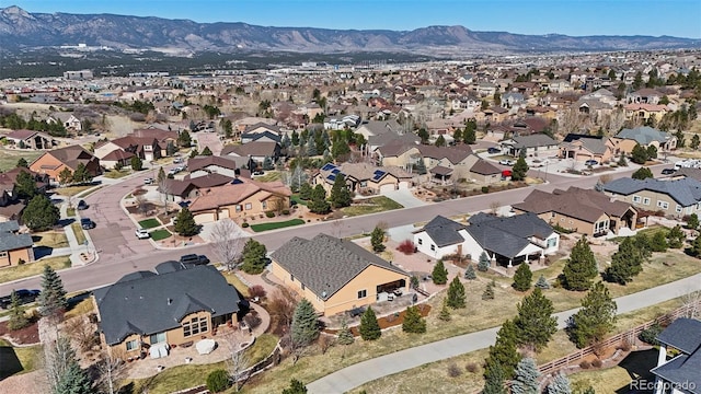 12441 Woodruff Dr, Colorado Springs, CO 80921 - aerial overview of property's location featuring nearby suburban area and a mountainous background