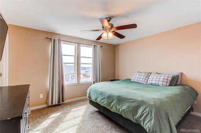 bedroom featuring ceiling fan, carpet, and baseboards