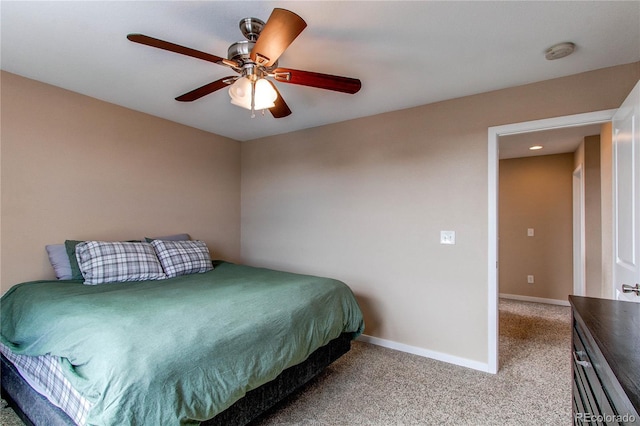 bedroom with carpet flooring, ceiling fan, and baseboards