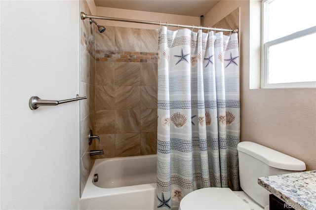 bathroom with toilet, vanity, and shower / tub combo with curtain