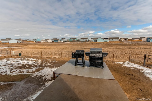 view of yard featuring a residential view and fence