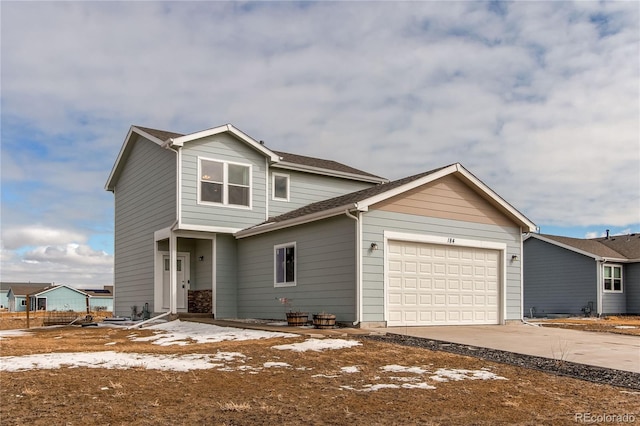 view of front of home featuring a garage and driveway