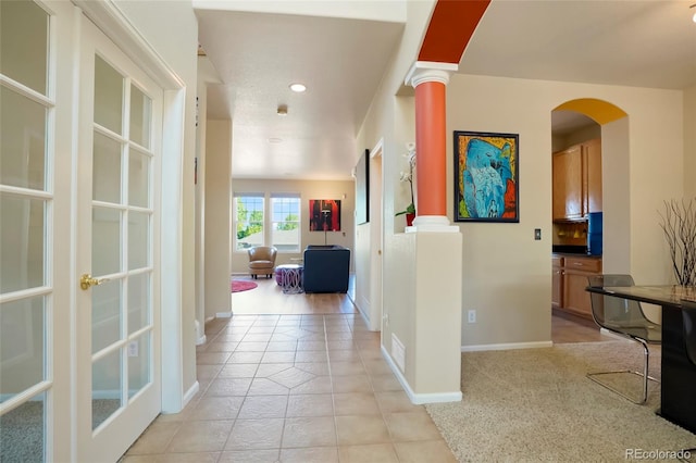 21395 E Greenwood Pl, Aurora, CO 80013 - hall featuring arched walkways, light tile patterned floors, baseboards, recessed lighting, and french doors