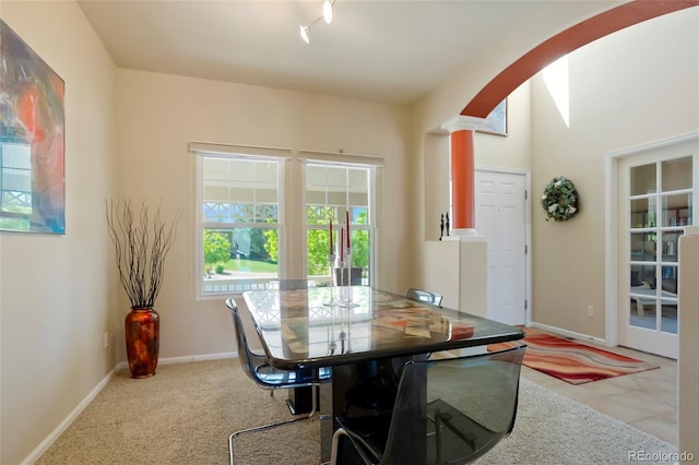 21395 E Greenwood Pl, Aurora, CO 80013 - dining room with arched walkways, ornate columns, and baseboards