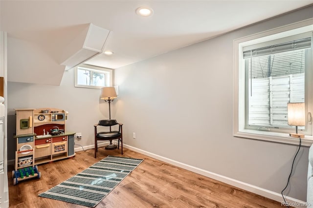 sitting room with recessed lighting, baseboards, and light wood finished floors