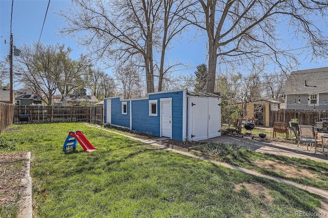 view of shed with a fenced backyard