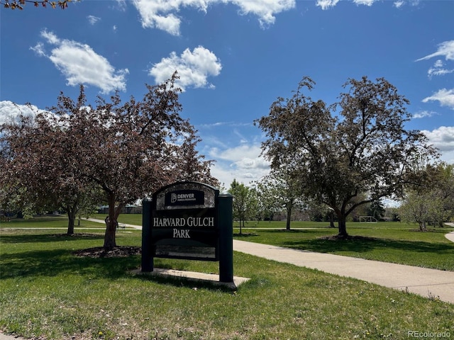 community sign featuring a lawn