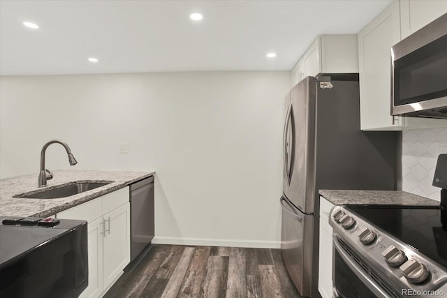 8055 E Colorado Ave Unit 8, Denver, CO 80231 - kitchen featuring stainless steel appliances, dark wood-style flooring, light stone counters, white cabinetry, and recessed lighting