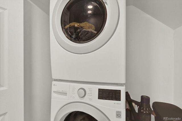 8055 E Colorado Ave Unit 8, Denver, CO 80231 - washroom featuring stacked washing machine and dryer