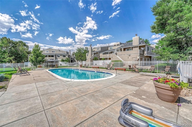 8055 E Colorado Ave Unit 8, Denver, CO 80231 - community pool featuring a patio area and a residential view