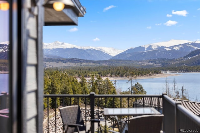 balcony with a water and mountain view