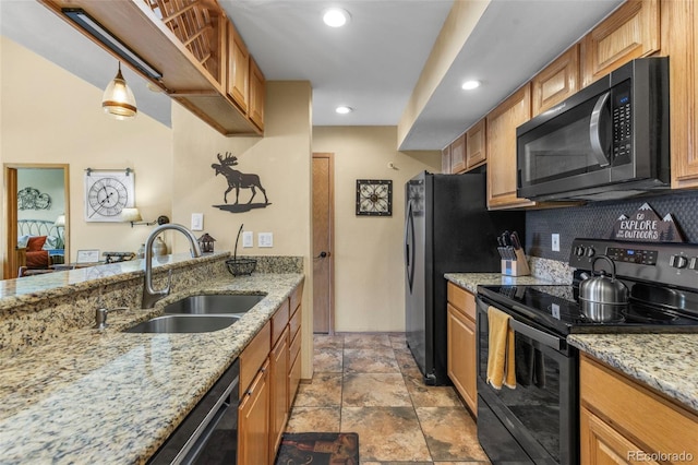 kitchen featuring stainless steel appliances, a sink, tasteful backsplash, brown cabinets, and recessed lighting