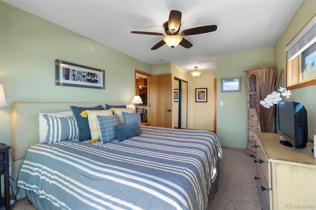 carpeted bedroom with a ceiling fan