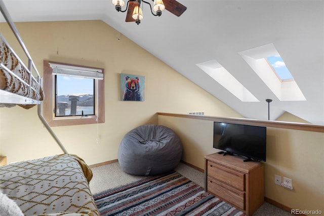 living area with a skylight, vaulted ceiling, carpet, and baseboards