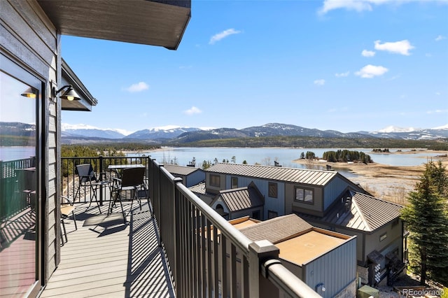 balcony with a water and mountain view