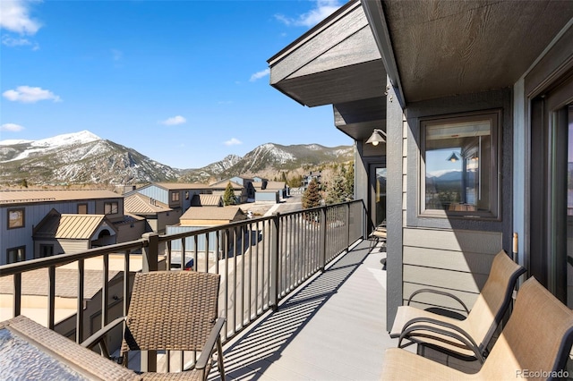 balcony with a mountain view and a residential view
