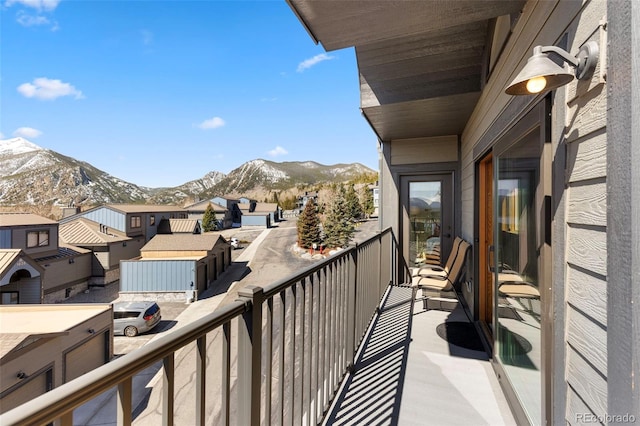 balcony featuring a mountain view and a residential view
