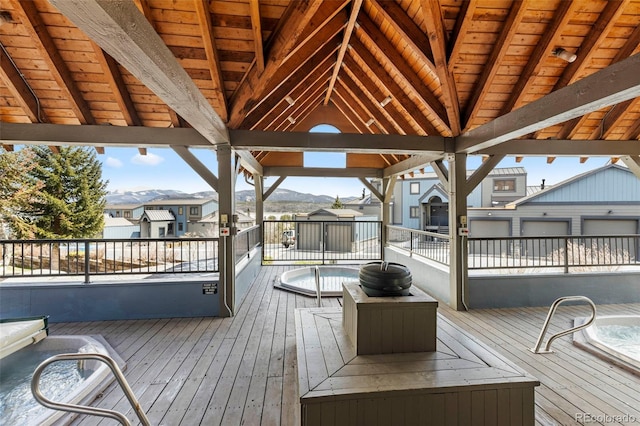deck featuring a mountain view and a residential view