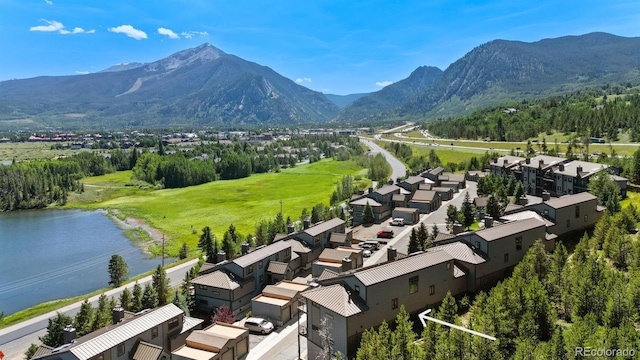 aerial perspective of suburban area with a water and mountain view
