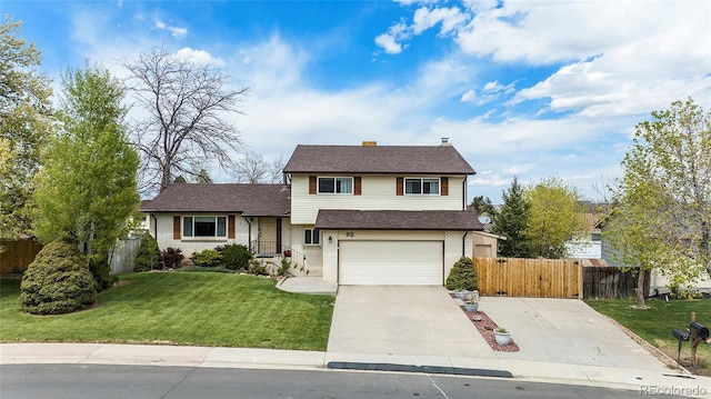 view of front of home with a front lawn, driveway, fence, a garage, and brick siding