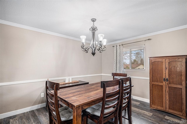 dining space featuring ornamental molding, dark wood finished floors, baseboards, and a notable chandelier