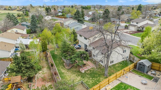 birds eye view of property with a residential view