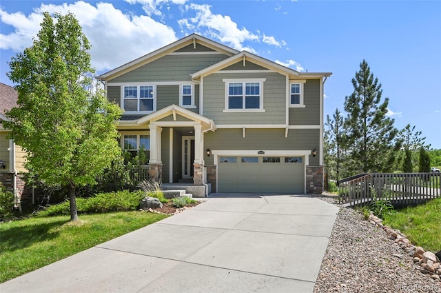 19782 W 59th Ave, Golden, CO 80403 - craftsman-style house with stone siding, an attached garage, and driveway
