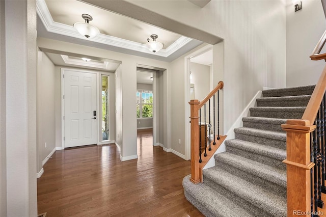 19782 W 59th Ave, Golden, CO 80403 - foyer featuring wood finished floors, stairway, a raised ceiling, and crown molding
